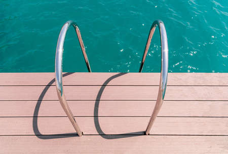 floating dock with composite deck and ladder at the marina.の写真素材