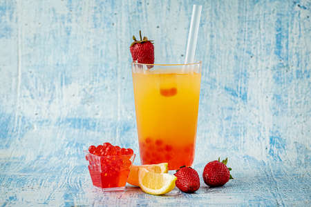 Lemonade with bubble tea on blue stone backgroundの写真素材