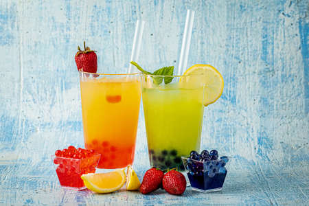 Lemonade with bubble tea on blue stone backgroundの写真素材