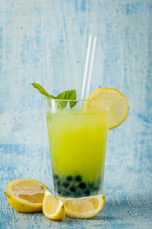 Lemonade with bubble tea on blue stone backgroundの写真素材