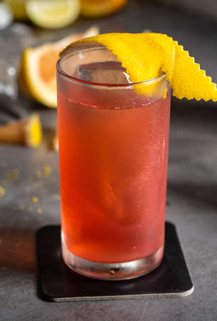 Luxury cocktail and cocktail shaker on black stone background