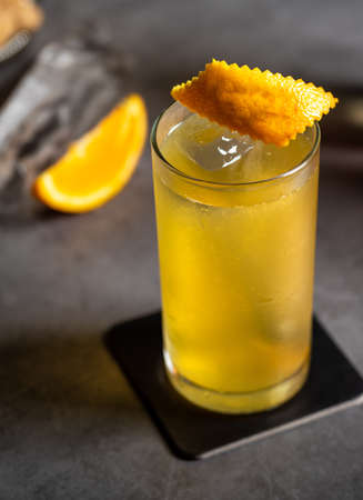 Luxury cocktail and cocktail shaker on black stone backgroundの写真素材