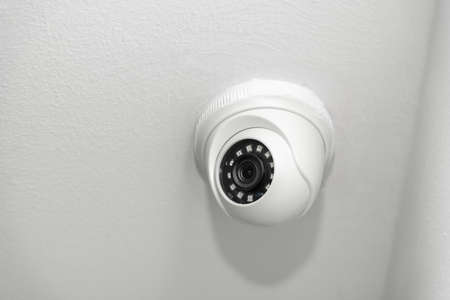 White ceiling mounted security camera with night visionの写真素材