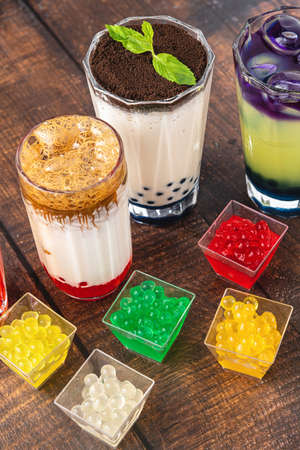 Lemonade with bubble tea on wooden background