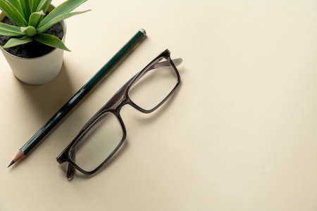 Office desk with copy space. home office. Glasses and pen on office desk top viewの写真素材