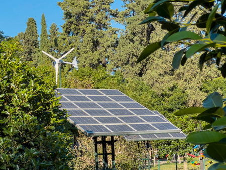 Wind turbine and solar panel installed in the green park area