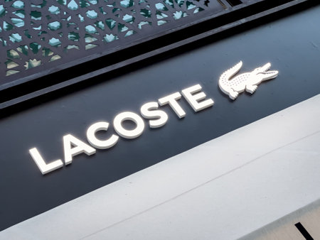 Antalya, Turkey - November 29, 2022: Illuminated logo of Lacoste store in Antalya Turkeyのeditorial素材