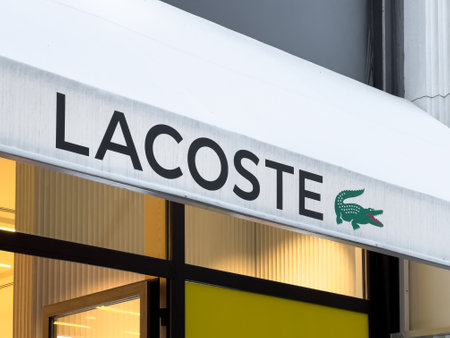 Antalya, Turkey - November 29, 2022: Illuminated logo of Lacoste store in Antalya Turkeyのeditorial素材