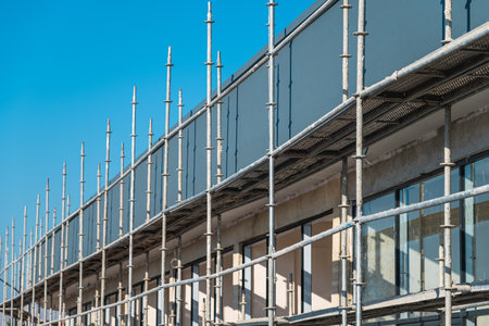 Construction scaffolding built on a new apartment building. new construction under construction