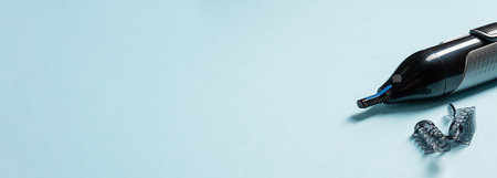 Top view of nose and ear hair trimmer isolated on blue backgroundの写真素材