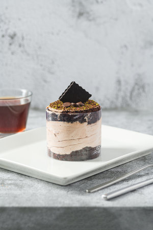 Chocolate single mini cake on a white porcelain plate