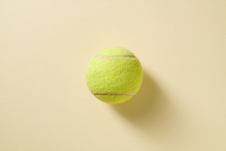 Top view of tennis ball on yellow backgroundの写真素材