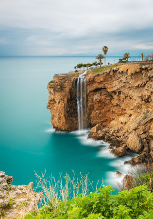 Long exposure image of the waterfall falling from the cliffs into the sea in Fener, Antalyaの写真素材