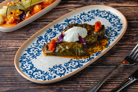 Turkish Dolma (sarma) stuffed vine leaves from Turkish traditional cuisine. Turkish name Stuffed...