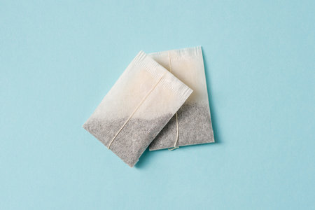 Top view of tea bag on blue backgroundの写真素材