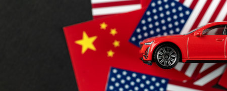 CHINA and USA economic war background concept, car standing on USA and CHINA flagsの写真素材