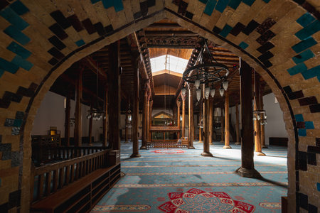 The interior of Esrefoglu Mosque in Konya Beysehir with its wooden columns and carpetsの写真素材
