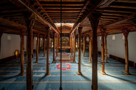 The interior of Esrefoglu Mosque in Konya Beysehir with its wooden columns and carpetsの写真素材