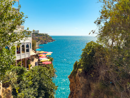 Kadinyari Canyon, a dramatic cliffside location in Antalya that opens onto the sparkling Mediterranean sea and umbrellasの写真素材