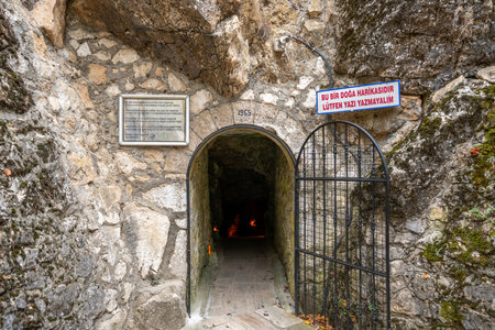 View of the entrance and illuminated interior of the Insuyu Cave in Burdur, Turkeyの写真素材