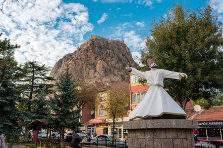 Afyonkarahisar, Turkey - November 10, 2025: Afyonkarahisar or Afyon Castle and the historic Uzun Carsiのeditorial素材