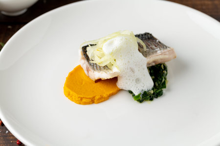 Elegant fine dining sea bass fish dish with modern Italian restaurant presentation