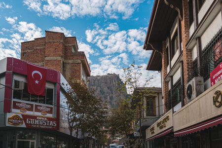 Afyonkarahisar, Turkey - November 11, 2025: Afyonkarahisar Castle overlooking Uzun Carsi street in city centerのeditorial素材