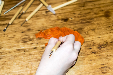 artist's Hands cut and modeling of animal figures of clay and plasticine instrumentsの写真素材