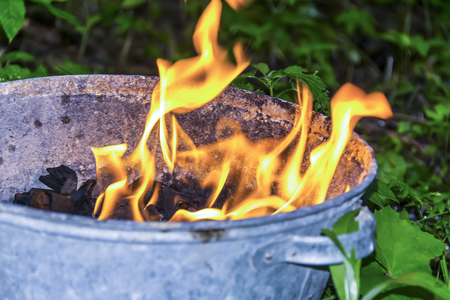 black smoldering coals fire bonfire texture backgroundの写真素材