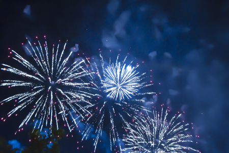 blue bright blurred fireworks effect abstract colorful background holiday celebrationÂ の写真素材