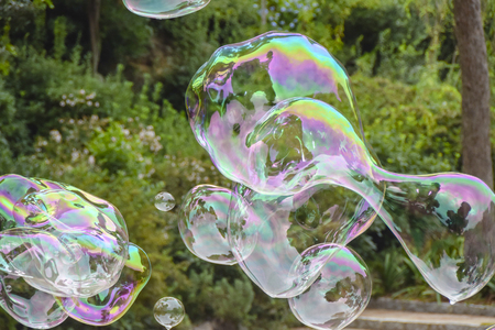 huge lots  soap bubbles multicolored bright reflections water summer bokehÂ 