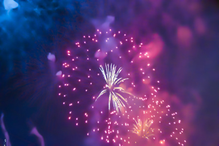 blue bright blurred fireworks effect abstract colorful background holiday celebrationÂ 