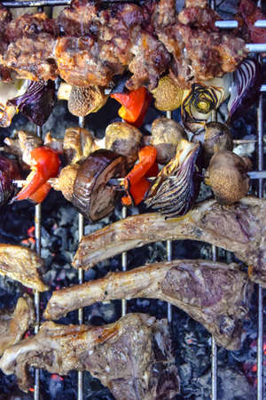 lamb ribs on the grill on a fire on a wire rack in the fresh airの写真素材