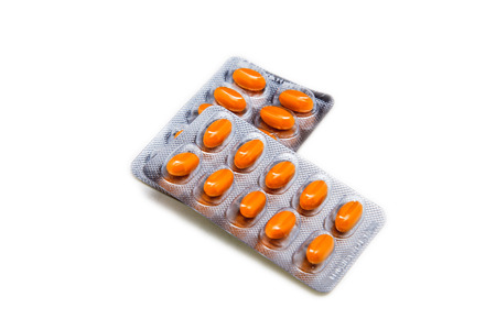 Medical pills in a sealed blister pack isolated on a white background