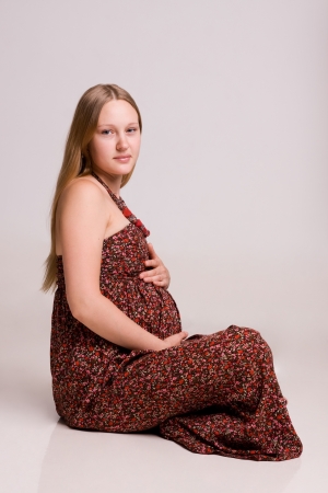 Pregnant woman on white backgroundの写真素材
