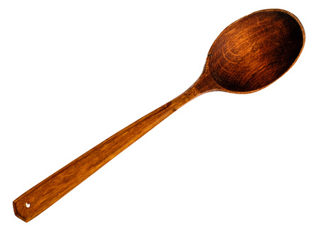 Old wooden spoon isolated on white.の写真素材