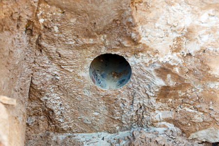 The hole in the concrete after diamond drilling.