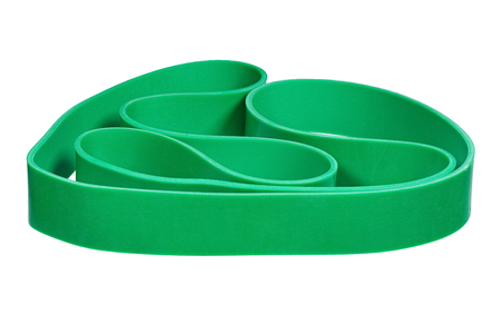 Twisted green rubber wrist band isolated on white.の写真素材
