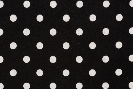 White polka dot on black background. Hi res photo.の写真素材