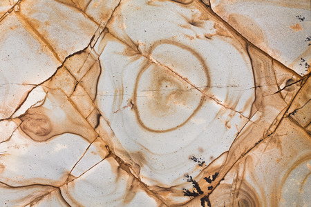 Abstract brown granite stone wall. High resolution photo.