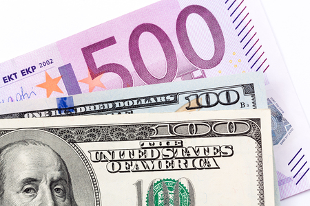 Close up of euros and dollars on white background. High resolution photo.の写真素材