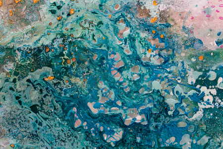 Abstract art with water. Colored flowes on pink background. High resolution photo.