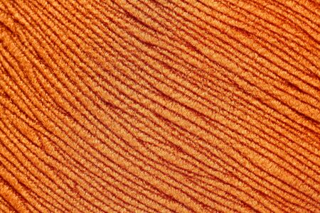 Contrast stripy orange textile background.