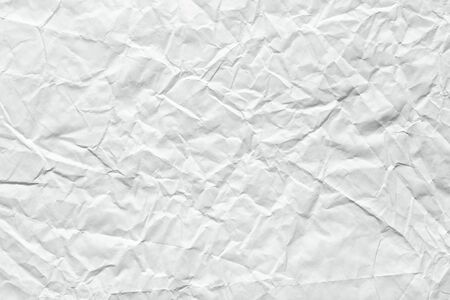 Crumpled paper background in classic white color for greeting card.の写真素材
