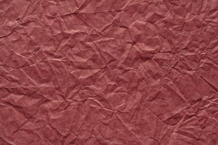Crumpled paper background in saturated wine color as part of your stylish greeting card.の写真素材