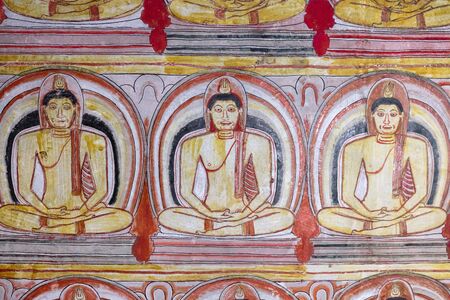 Ancient Buddha image in Dambulla Rock Temple caves, near Golden Temple of Buddha, Sri Lanka.の写真素材