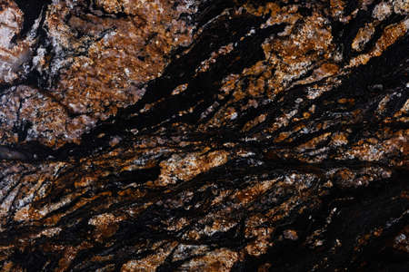 Black Magma granite background in stylish dark color.