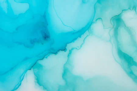 Abstract painting background in a gentle light blue color. Painted by alcoholic ink.の写真素材
