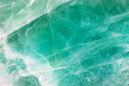 Green Fluorite. Gemstone background. Matt natural semi precious mineral pattern. Semiprecious stone texture, ceramic wall, floor digital tiles. Material for unique interior, exterior design decorationの写真素材