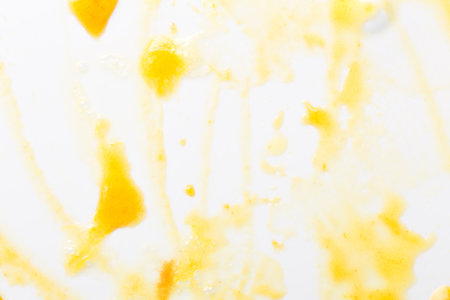 Drops of yellow jam. Abstract background.